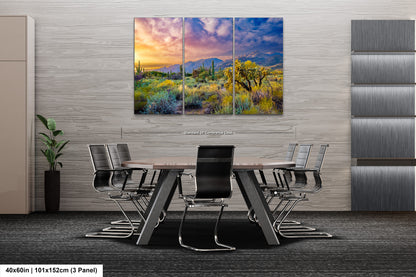 a dining room table with chairs and a painting on the wall