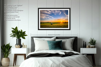 a bedroom with a bed and a picture hanging on the wall