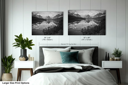 a bedroom with a bed and two pictures on the wall