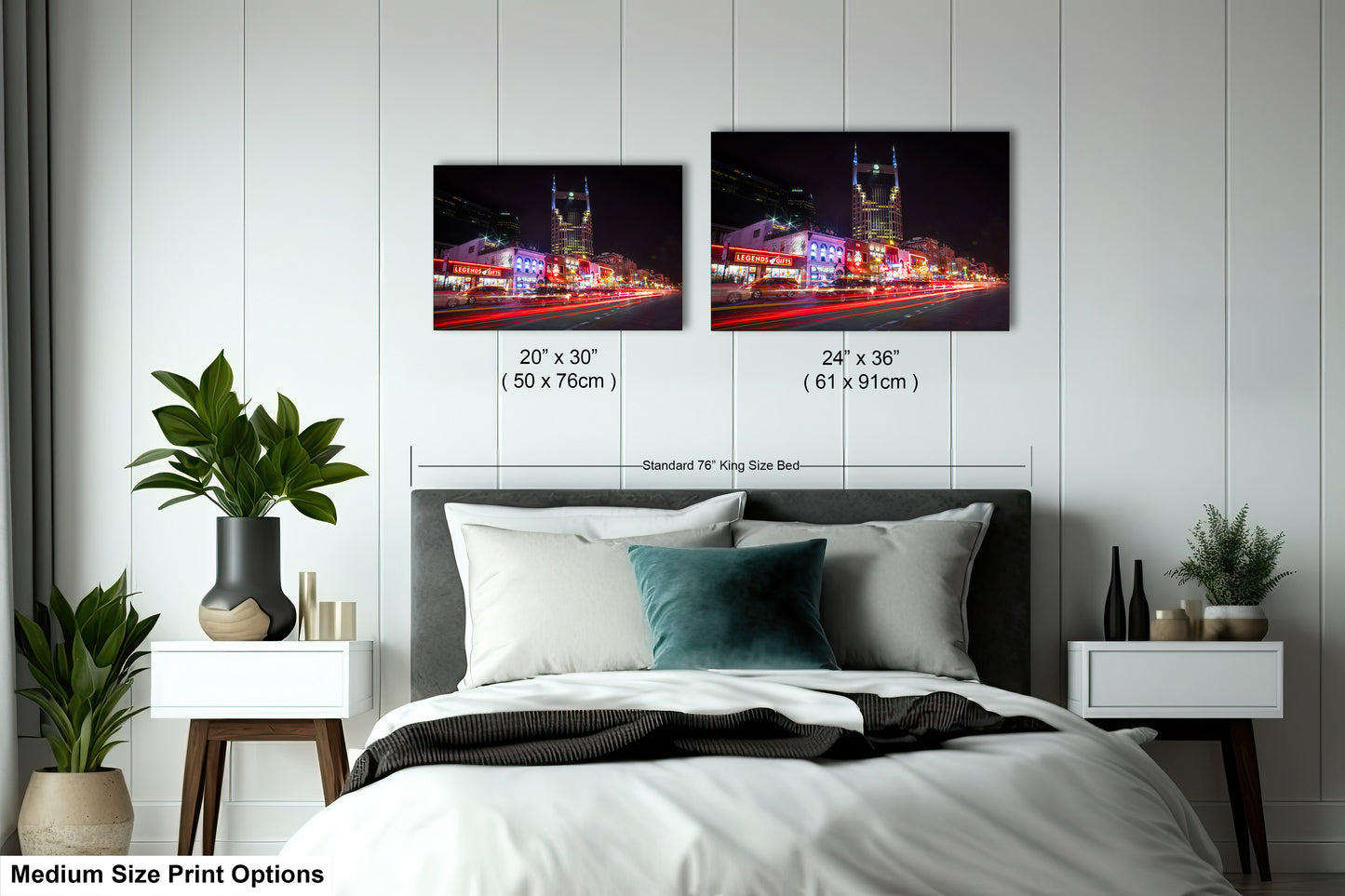 a bedroom with a bed and two pictures on the wall