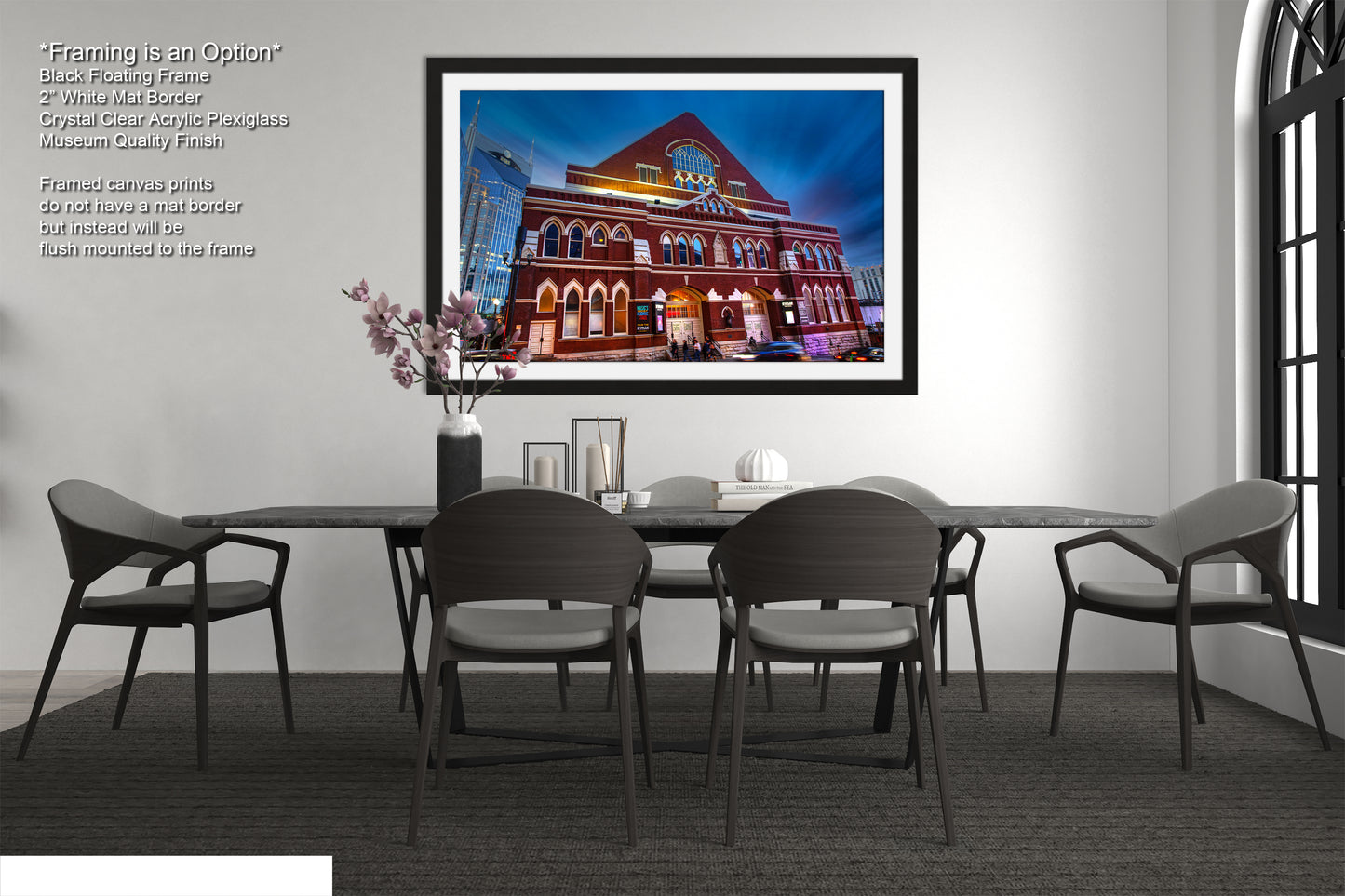 a dining room with a picture of a building on the wall