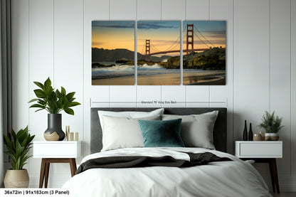 a bedroom with a bed and two paintings on the wall