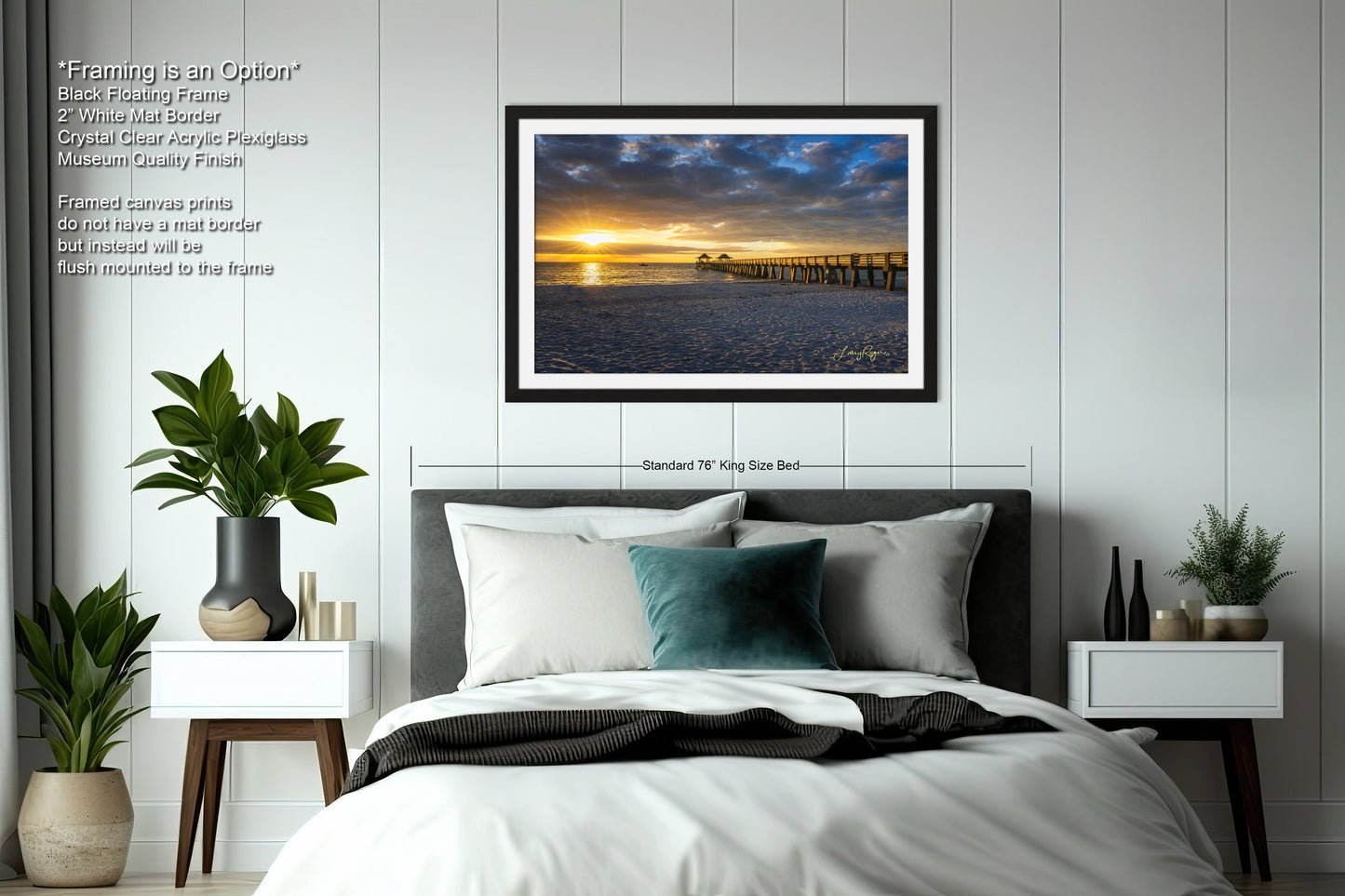 a bedroom with a bed and a picture on the wall