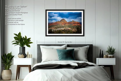 a bedroom with a bed and a picture on the wall