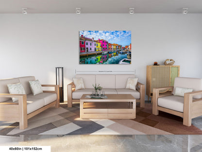 a living room filled with furniture and a painting on the wall