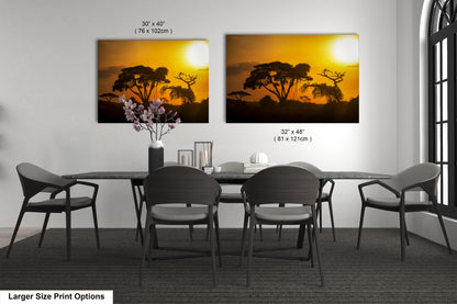 a dining table with four chairs and a vase of flowers
