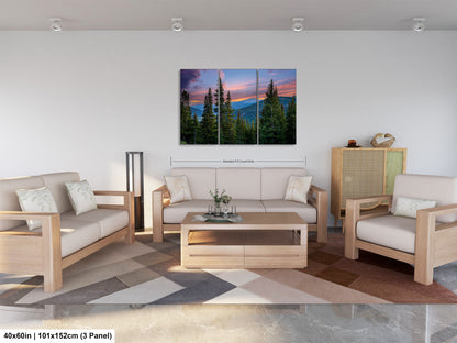 The image is a modern living room with a large, colorful painting of a forest scene hanging on the wall. The room is furnished with a sofa, two chairs, and a coffee table, creating a comfortable and inviting atmosphere.