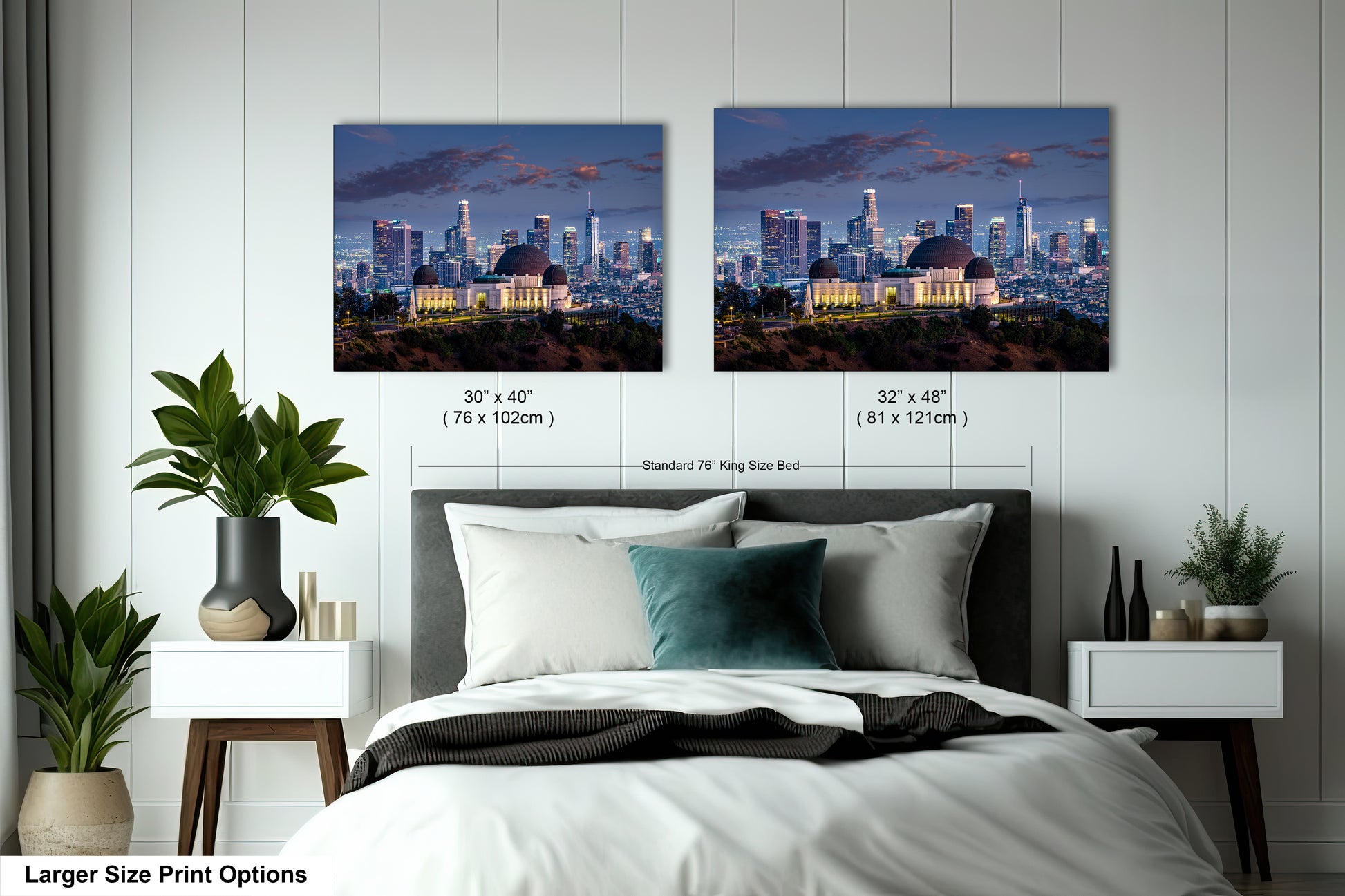 a bed with two pictures of a city in the background