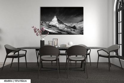 a black and white photo of a dining room table