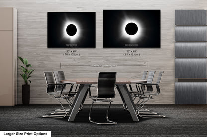a dining room table with chairs and a picture of the eclipse