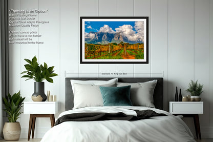 a bedroom with a bed and a painting on the wall