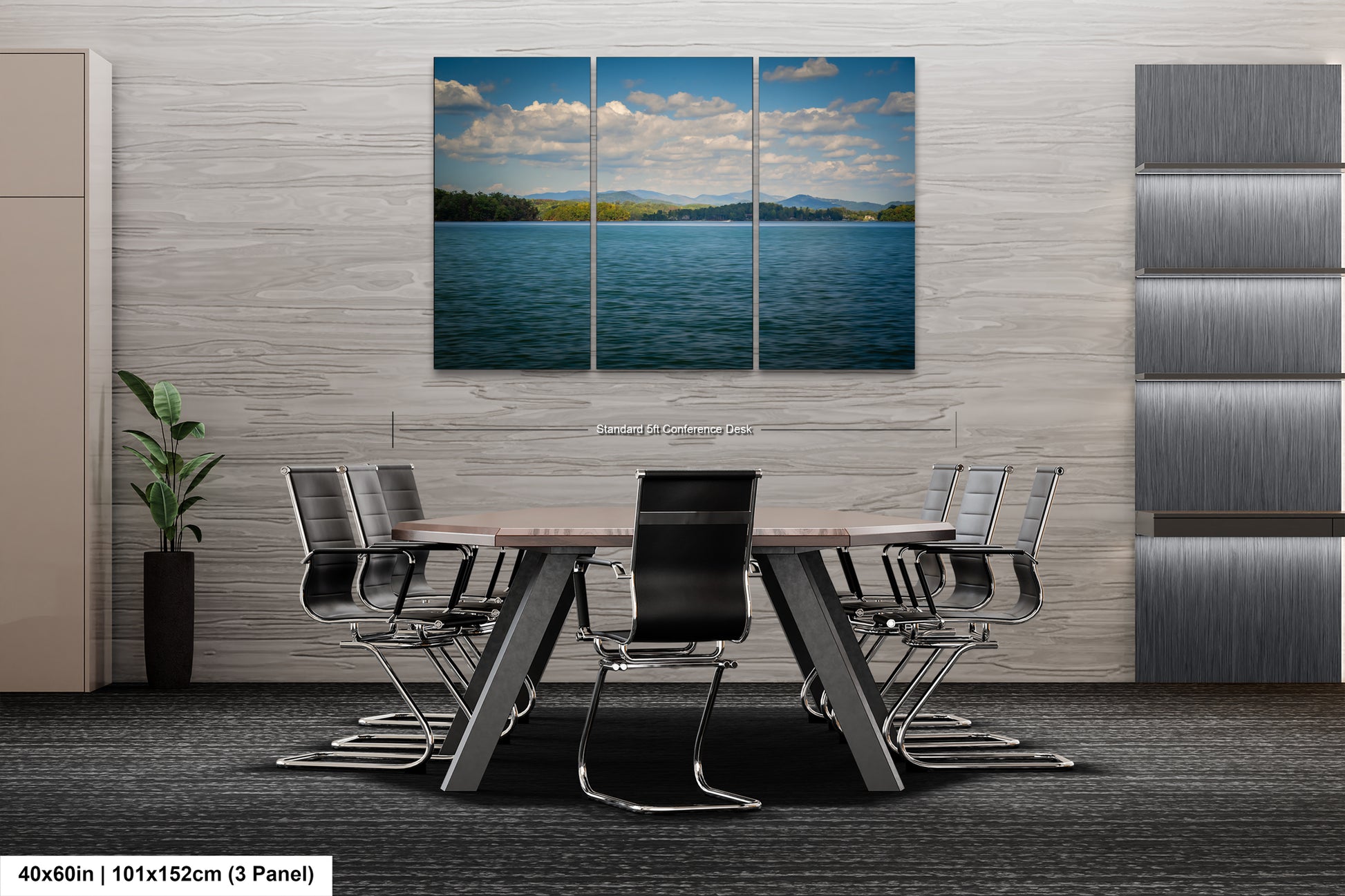 a modern office space with a large, three-panel landscape painting of a serene lake and mountains hanging on the wall. The painting is surrounded by a minimalist design, with a gray wall and a gray carpeted floor. In the foreground, there is a conference table with several chairs arranged around it, suggesting a professional setting for meetings or discussions.