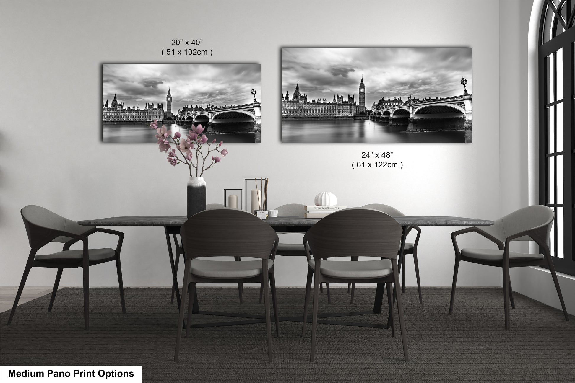 a black and white photo of a dining room table