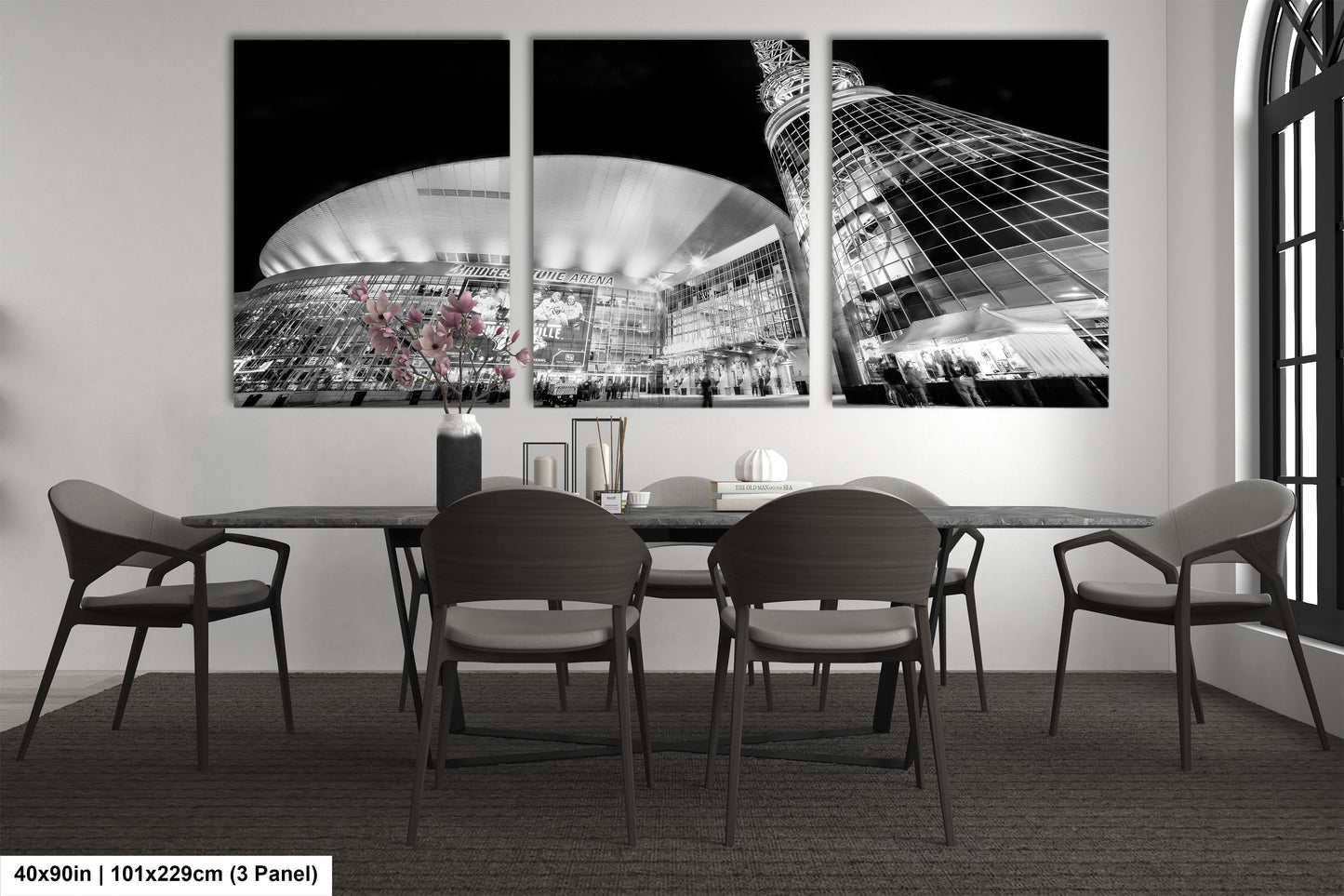 a black and white photo of a dining room