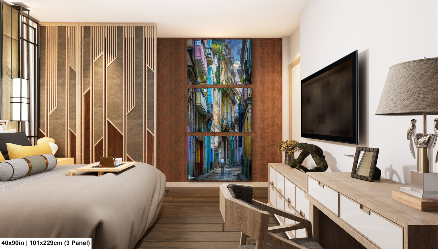 a bed room with a neatly made bed and a flat screen tv