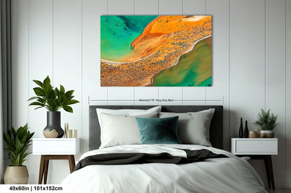 a bedroom with a bed and a painting on the wall