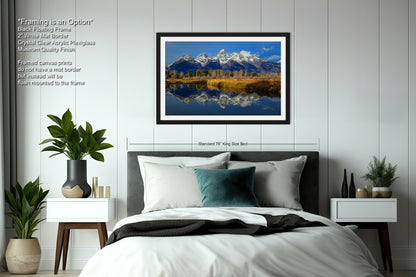 a bedroom with a large bed and a painting on the wall