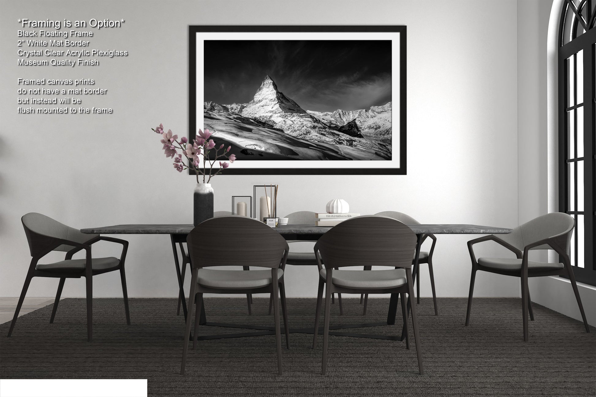 a black and white photo of a dining room table