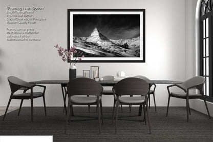 a black and white photo of a dining room table