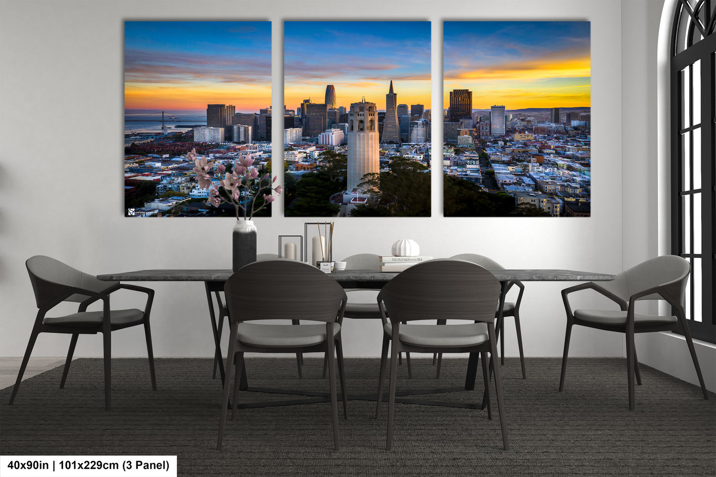 a dining room table with four chairs and a view of a city