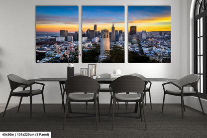 a dining room table with four chairs and a view of a city