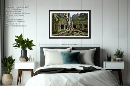 a bedroom with a bed and a picture hanging on the wall