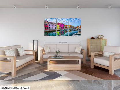 a living room filled with furniture and a painting on the wall