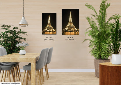 a room with a table and chairs and a picture of the eiffel tower