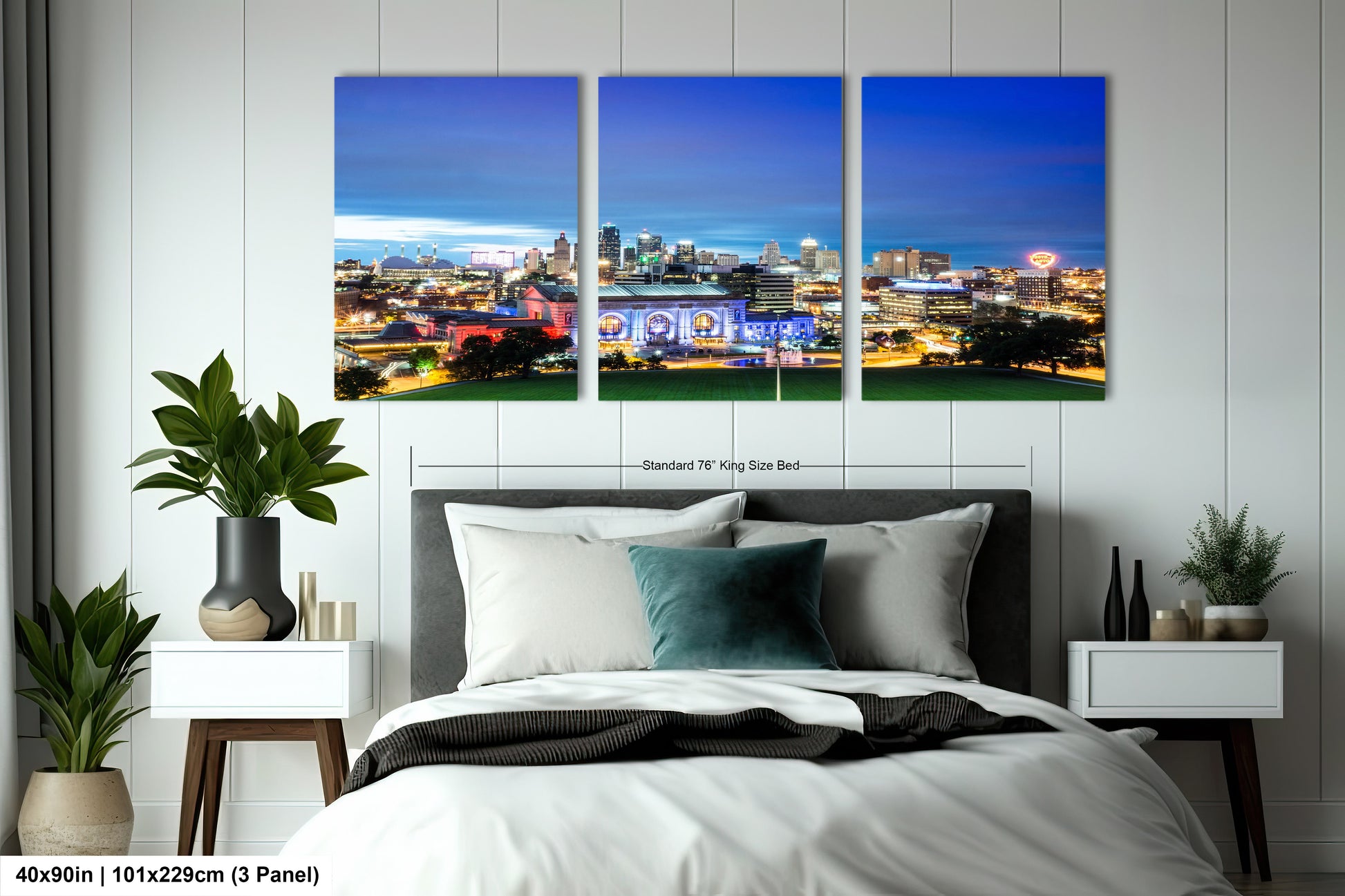 a bedroom with a large bed and three paintings on the wall