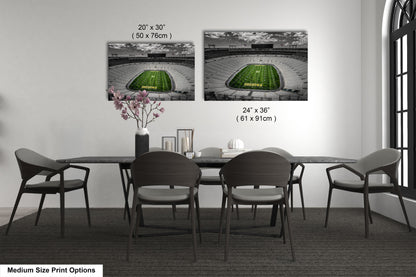 a dining room table with chairs and a vase with flowers