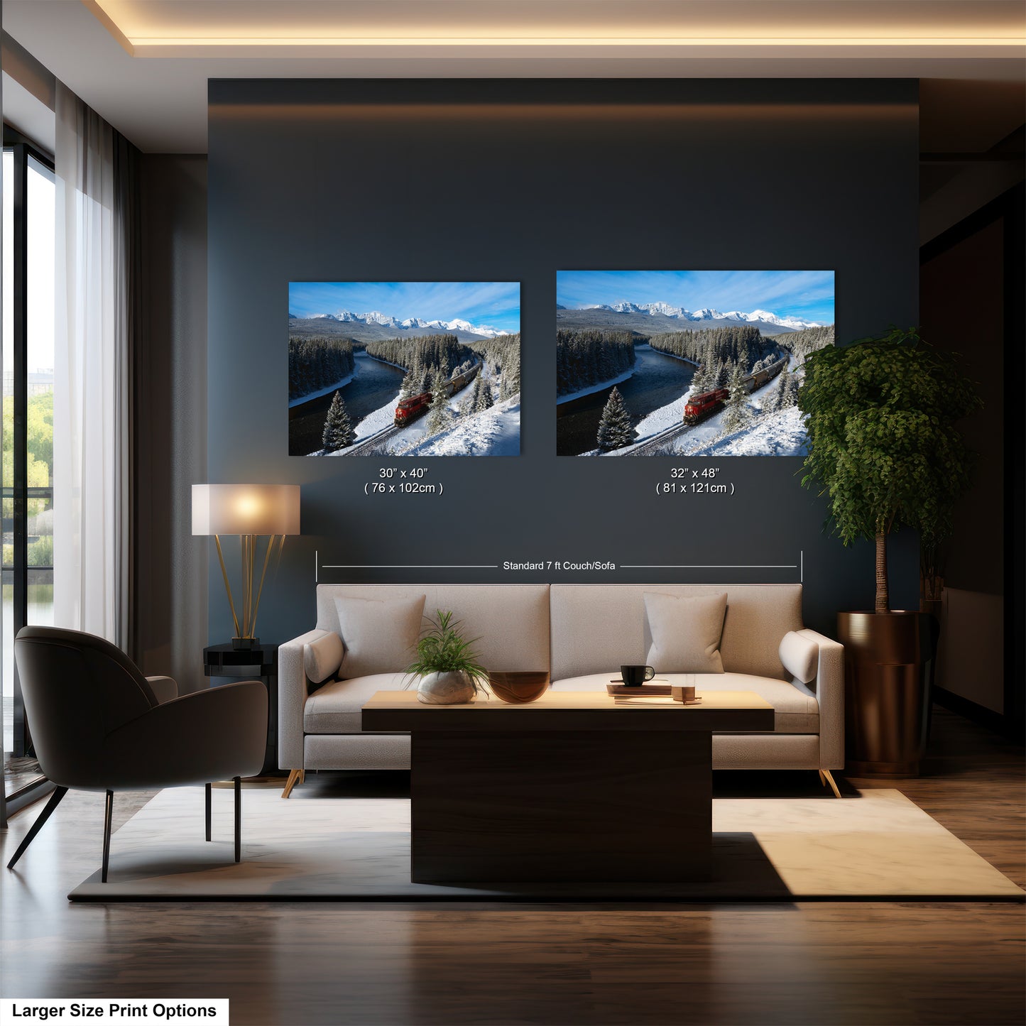 The image is a modern living room with a large sofa, a coffee table, and a potted plant. There are two framed landscape photographs hanging on the wall, depicting snowy mountains and a river. The photographs are of similar size, and the text indicates that the larger print option is available for those who prefer a bigger print size.