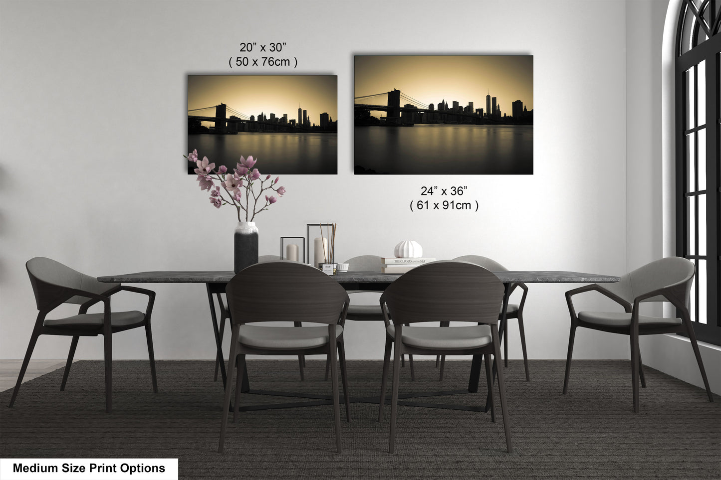 a dining table with four chairs and a vase of flowers