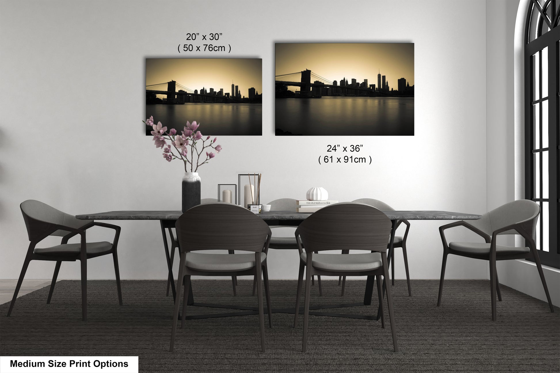 a dining table with four chairs and a vase of flowers