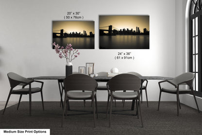 a dining table with four chairs and a vase of flowers