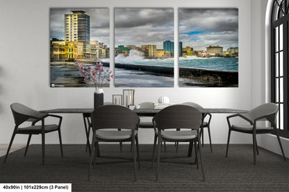a dining room table with four chairs and a painting on the wall