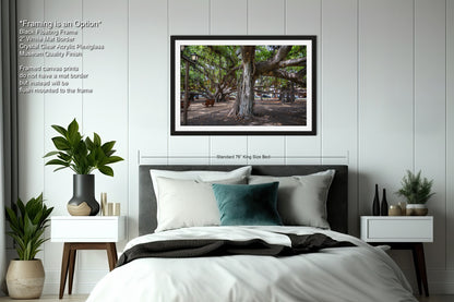 a bedroom with a bed and a picture hanging on the wall