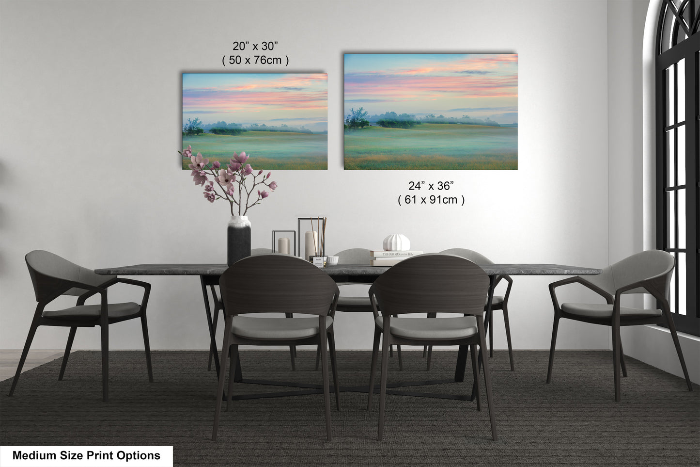 a dining table with four chairs and a vase of flowers