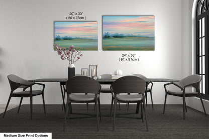 a dining table with four chairs and a vase of flowers