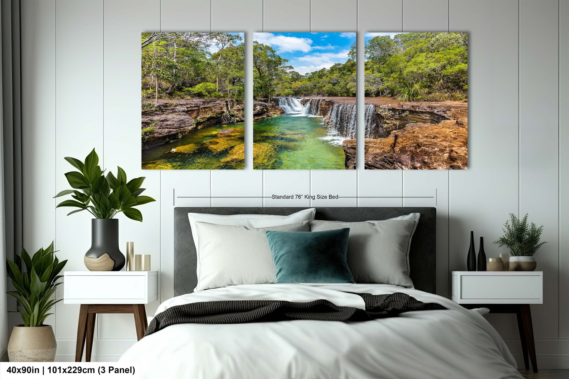 a bedroom with a bed and two paintings on the wall
