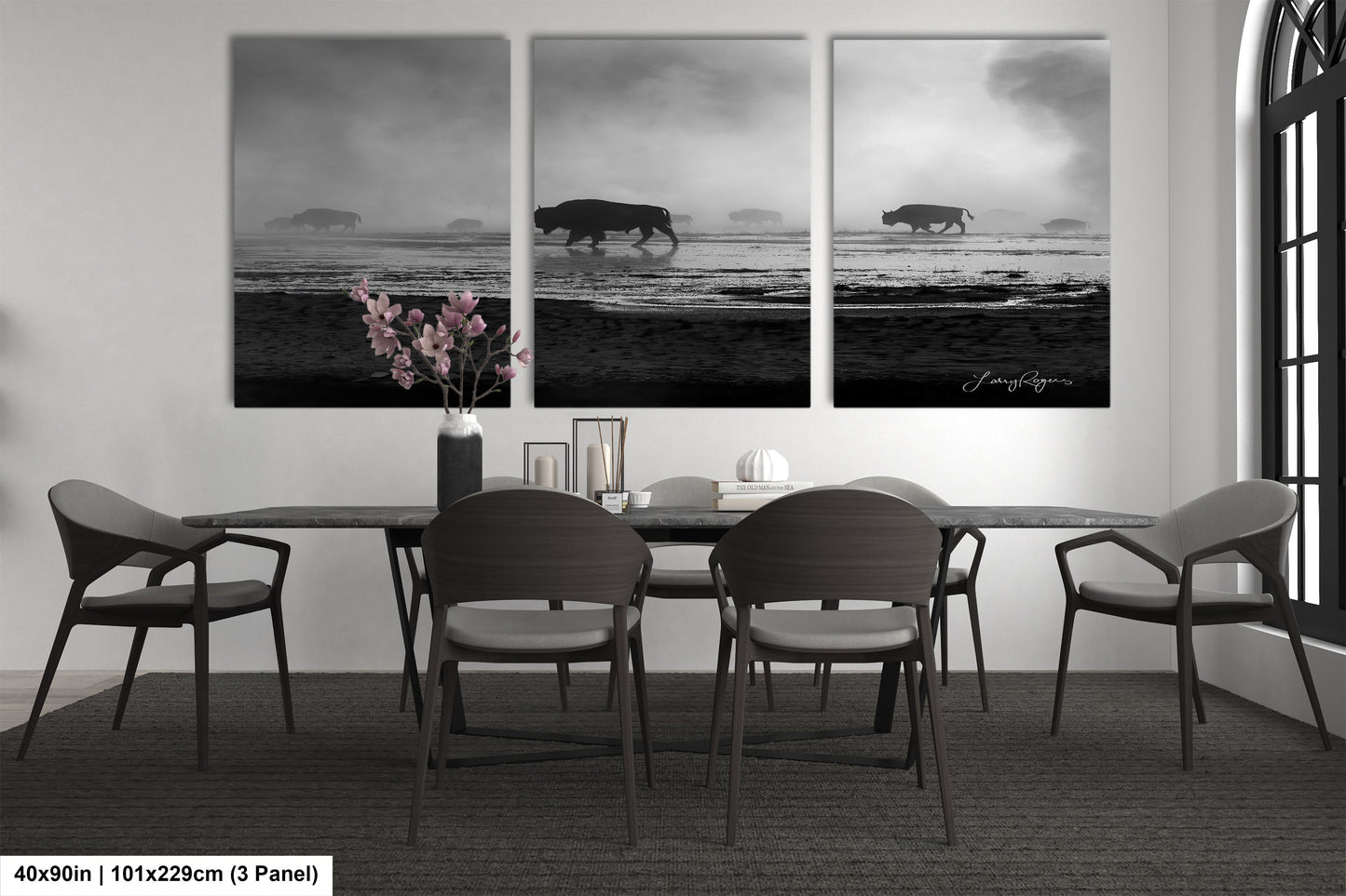 a black and white photo of a dining room table
