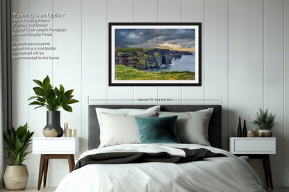 a bedroom with a bed and a picture hanging on the wall