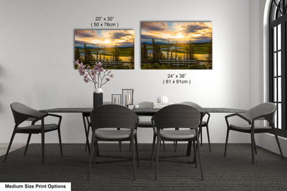 a dining table with four chairs and a vase of flowers