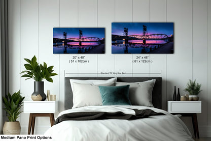 a bed room with a neatly made bed and two pictures on the wall