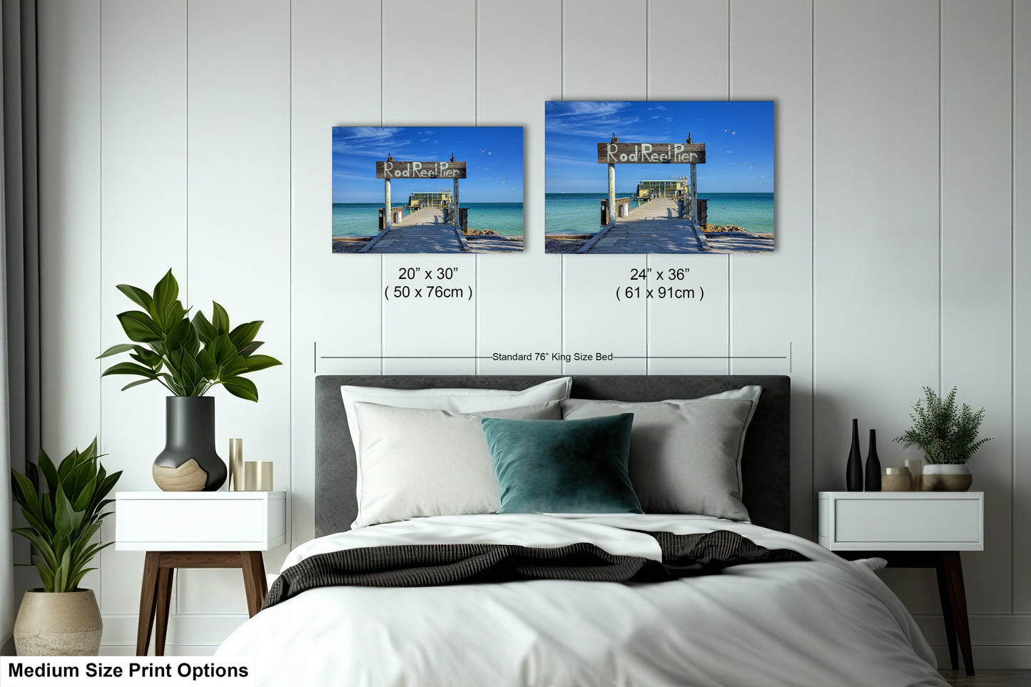 a bed room with a neatly made bed and two pictures on the wall