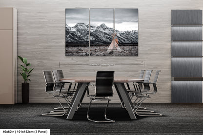 a dining room table with a black and white photo of a woman in a dress