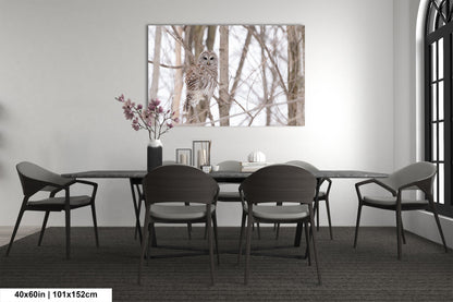a dining room table with chairs and a vase of flowers