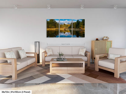 a living room filled with furniture and a painting on the wall
