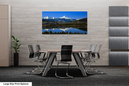 a dining room table with a view of a mountain range