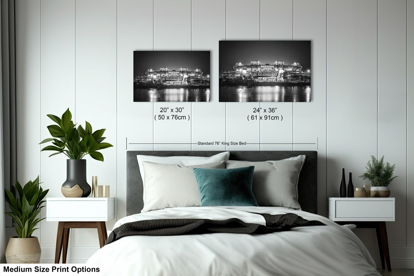 a bedroom with a bed and two pictures on the wall