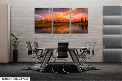 a dining room table with chairs and a painting on the wall